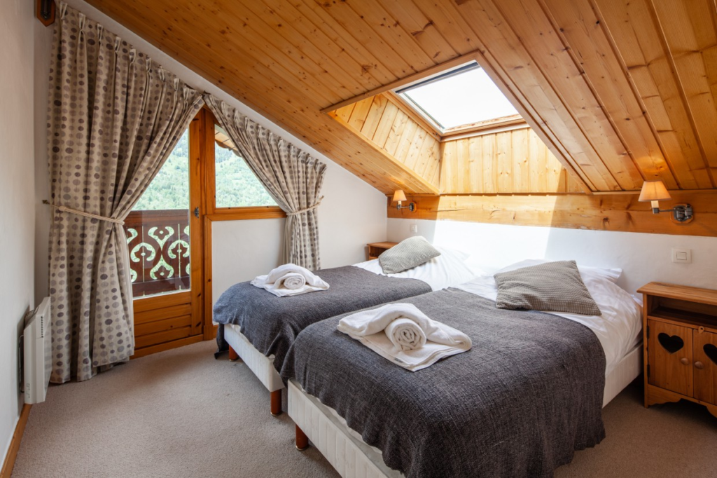 Ski chalet bedroom interior with two beds